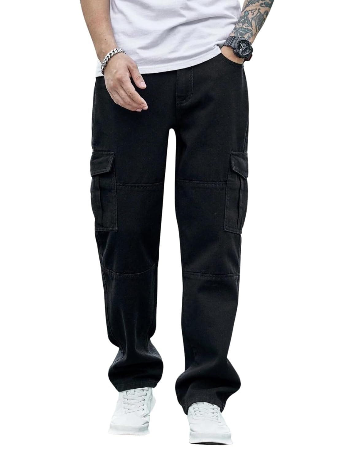 A person is wearing black pants, standing confidently with hands in their pockets. The fabric appears smooth and the trousers have a tailored fit.