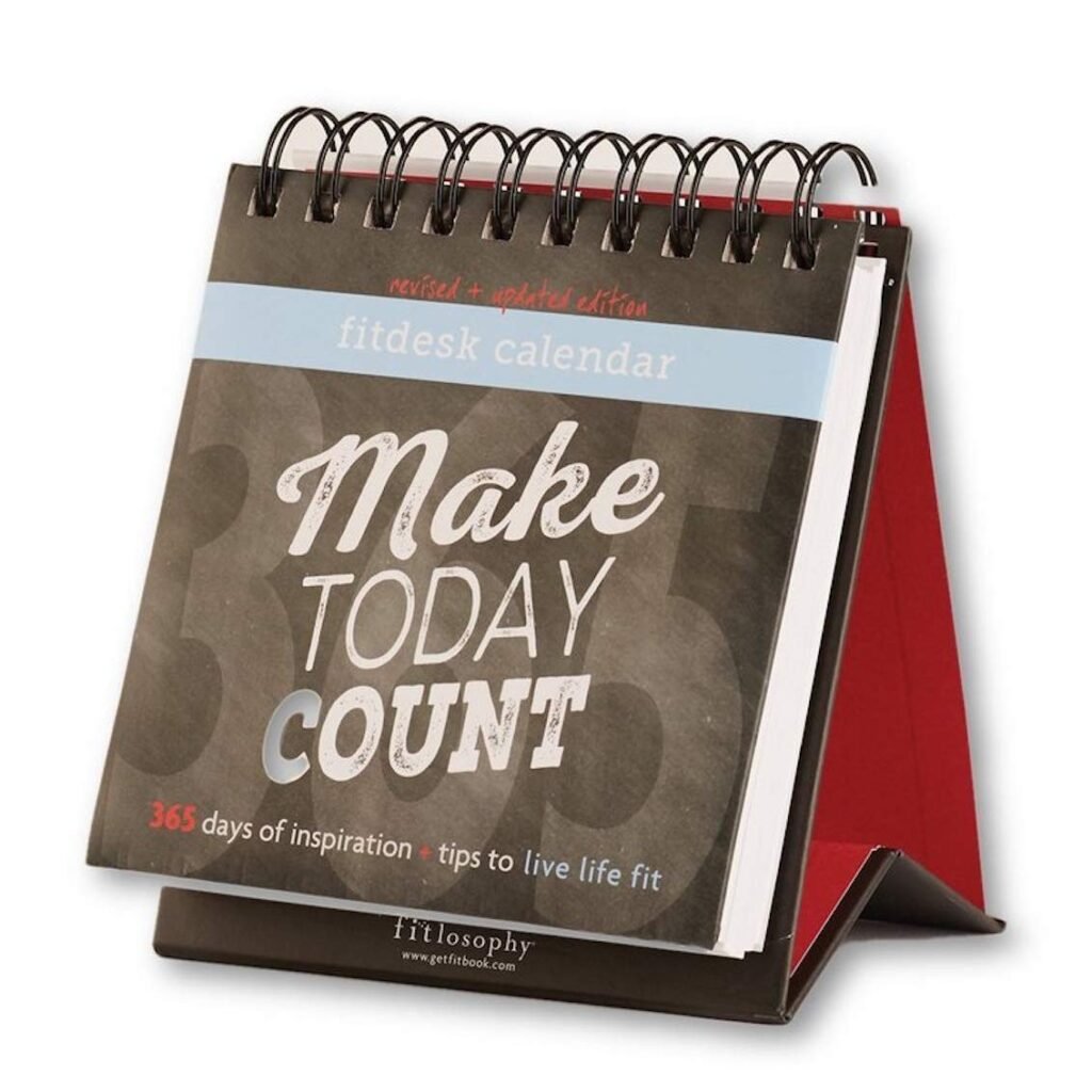 A calendar titled "FitDesk" featuring the phrase "365 days of inspiration tips to live life fit" with a modern design and bold typography. The cover includes the word "Fitlosophy" prominently displayed.